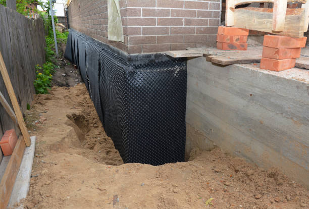 Happy homeowners after waterproofing job in Palmer
